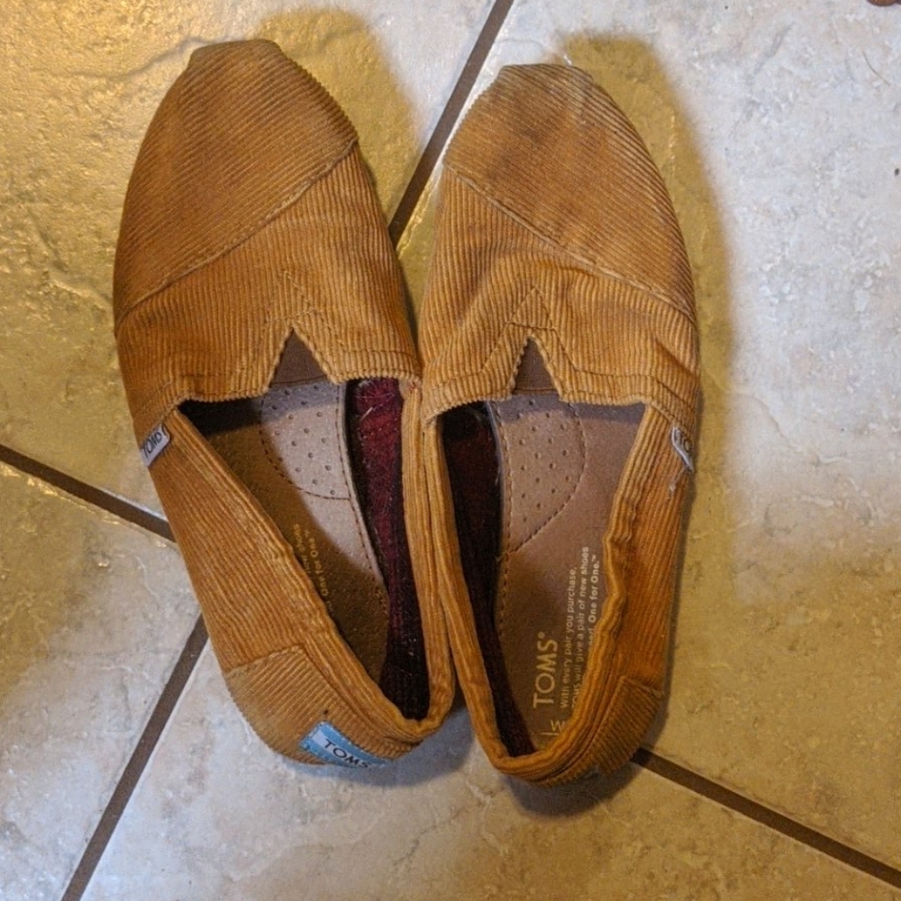 Two pairs of previously loved Toms